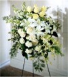 A Quiet Tribute in a monochromatic color scheme of White and Off-White Spray Roses, Lilies, Carnations and Dendrobium Orchids