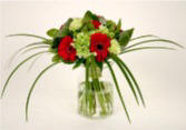 Tropical Ti leaves embrace this sophisticated hand-tied bouquet 