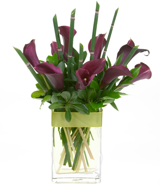 Twenty four gorgeous Long Stem Roses in a clear vase