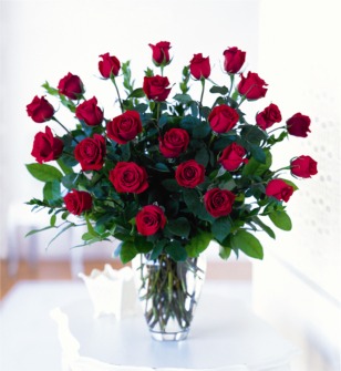 Twenty four gorgeous Long Stem Roses in a clear vase
